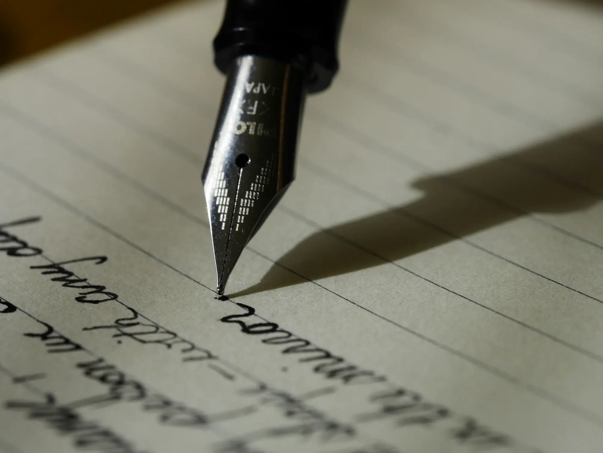 A fountain pen writing on paper